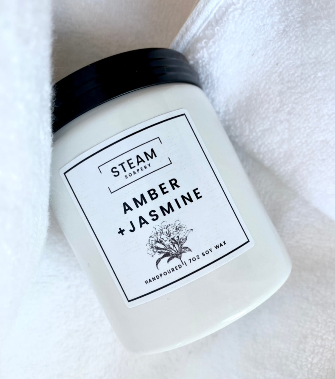 Amber Jasmine Candle on white Towel